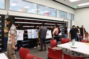 individuals looking at student posters